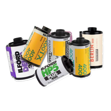 Black & White Films Various rolls of black and white and colour film stacked together.